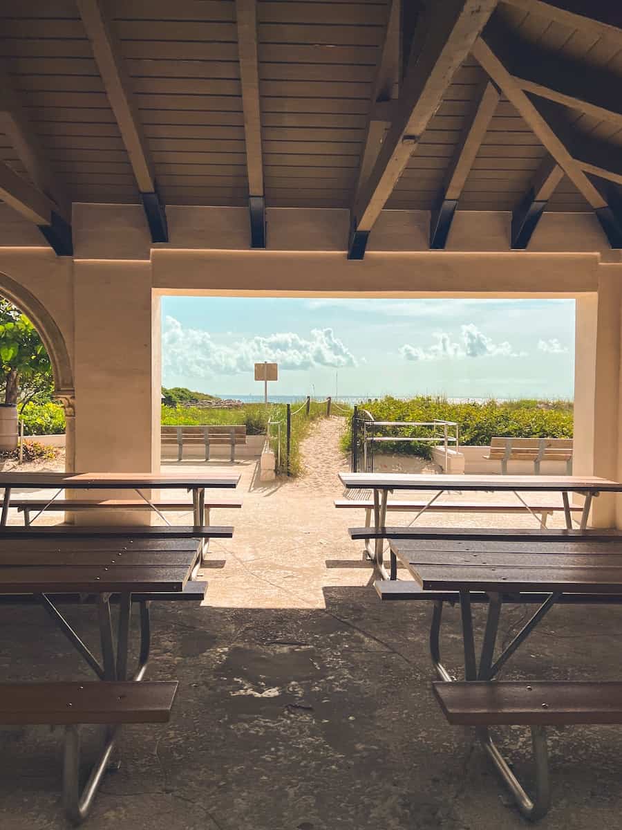 a couple of benches that are under a roof
