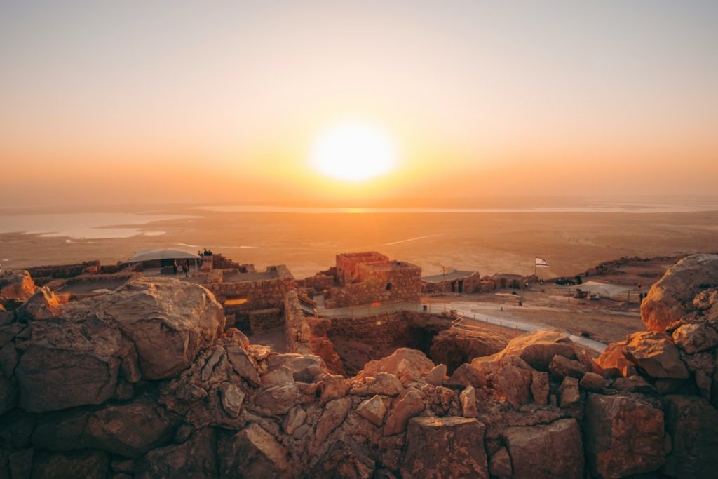 brown rock formation during sunset